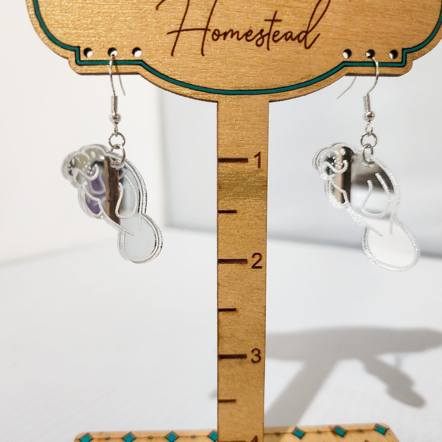 Mirrored Dangling Manatee Earrings